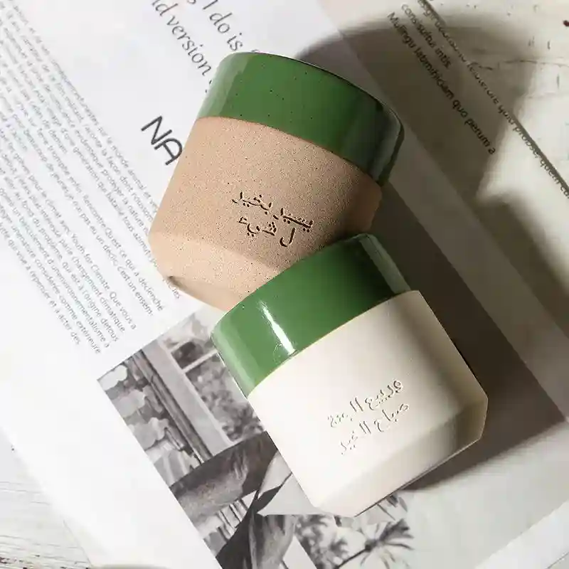 Luxury Arabic coffee cups setup with dates and golden pot